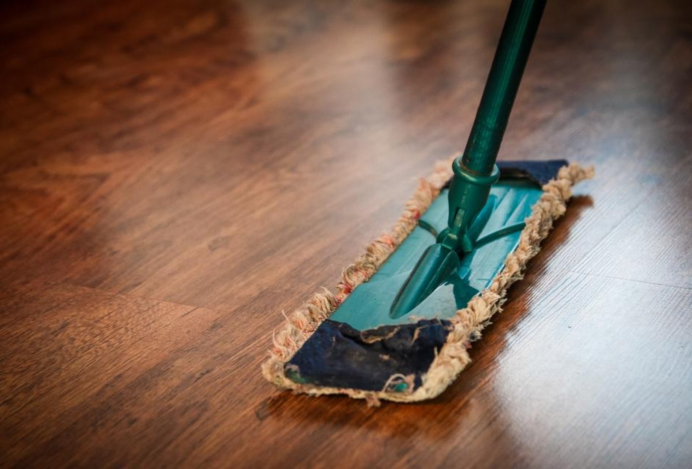 A hard floor washed by hand — representative imagery, not a specific Perham Services job