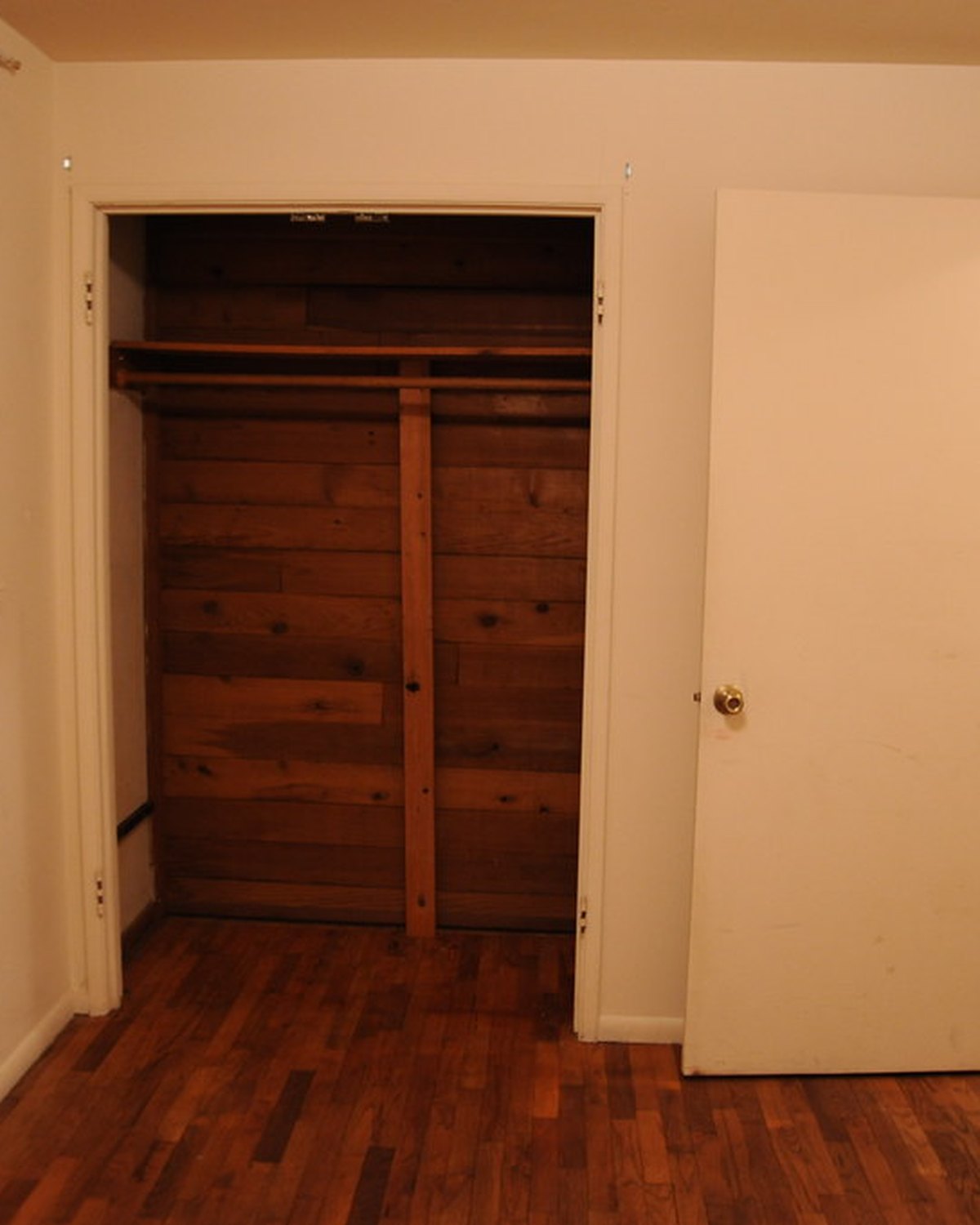 A bedroom vacuumed and mopped — representative imagery, not a specific Perham Services job